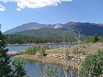 A lake and mountains in Pike National Forest.