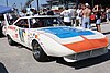 the front view of a white stock car