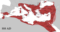 A map centred on Europe, North Africa and West Asia showing the territorial extent of the Byzantine Empire in 555 AD. Portions of present day Spain, Libya, Algeria, Morocco, Egypt, Syria, Crimea, Israel and Palestine; and all of Italy, Greece, Cyprus and Turkey are colored red to show Byzantine control. Three areas, one to the top centre of Turkey, one to the left of Israel and one to the bottom of Libya are colored pink to indicate their status as Byzantine vassals