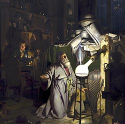 Dr Alchemischt uf dr Suechi noch em Stai vu dr Wyse (1771) vum Joseph Wright of Derby, illuschtriert d Entdeckig vum Phosphor dur dr Hennig Brand