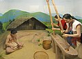 A diorama and wax figures of the Wancho people in a museum