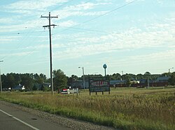 Welcome sign and houses in Mole Lake