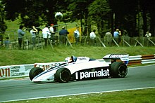 Sideview of a white-and-dark blue Brabham racing car during a race