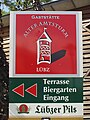 Logo Lübzer Pils, met afbeelding Alter Amtsturm