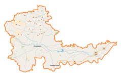 Mapa konturowa powiatu proszowickiego, blisko centrum na dole znajduje się punkt z opisem „Piekary”