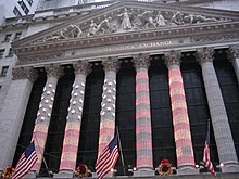 Photograph of the columns of the NYSE lit up for Christmas