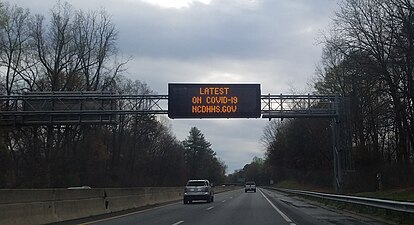 A sign in Winston-Salem, North Carolina, USA, displaying the website for information on COVID-19 in North Carolina.