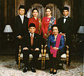 Image 33Formal family portrait of former Indonesian's President B.J. Habibie. Women wear kain batik and kebaya with selendang (sash), while men wear jas and dasi (western suit with tie) with peci cap. (from Culture of Indonesia)