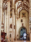 Northern aisle, divided in two by an additional arcade. The base of one arch covers an imperial eagle painted before modification of the vaulting.