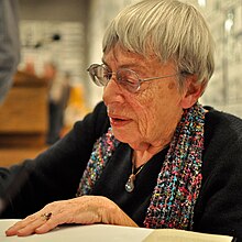 Ursula K. Le Guin signing a book in 2013