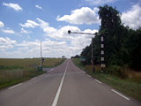 Bahnübergang mit Halbschranken und Zusatzlicht