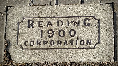 A plaque in Erleigh Road on the pavement outside Café YOLK, placed around 1903 to herald the arrival of the electric tram.