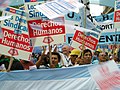 Image 35Union members march in Argentina on Human Rights Day in December 2005. The signs read "Worker rights are human rights..