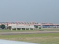 The airport welcome sign along the tarmac in front of Terminal 2