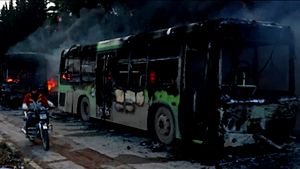 caption: A burnt bus near Nanjing Road, Shanghai, in which heavy fighting took place.