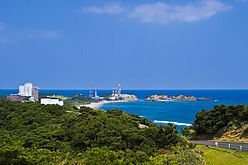 Overlooking the Osaki Range, surrounded by green mountains and the sea of coral reefs.