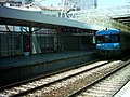 A regional train pulling into Track 4 of Sete Rios Station, June 2008