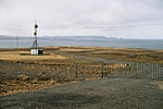 A view of the bay. Road and a radio tower in front.