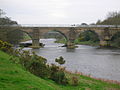 The 'new' railway bridge can be seen through the arch on the left