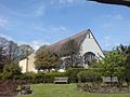 A view of Prittlewell Priory, Southend-on-Sea, from an adjacent garden in the surrounding Prittlewell Park.