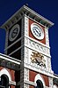 The Christchurch Chief Post Office clock tower with the Royal coat of arms of the United Kingdom