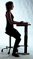 Balanced sitting by using a specialised chair to replicate partial squatting more authentically – more weight on feet