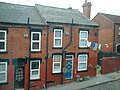 Across-street line in Armley, Leeds, showing pulley operated at street level, July 2004.