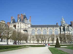 "Golden Gate" portal to the oval courtyard (left) and Saturnin Chapel (right), rebuilt with new façade by Henry IV