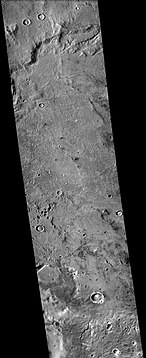 Sklodowska (Martian crater), as seen by CTX camera (on Mars Reconnaissance Orbiter). Small channels are visible along the eroded, southern rim.