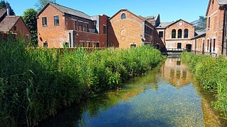 The River Test with shop and bar to left, visitor centre ahead, 2015