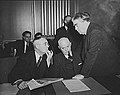 Image 20John L. Lewis (right, President of the United Mine Workers, confers with Thomas Kennedy (left), UMW Secretary-Treasurer of the UMW, and a UMW official at the War Labor Board in 1943 about a coal miners' strike.