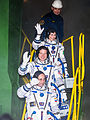 Crew of Soyuz TMA-15M wave to spectators before launch.