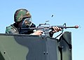 USAF Staff Sergeant with a GAU-5/A converted to a GUU-5/P and fitted with a Blank Firing Adaptor (BFA) for firing blanks.