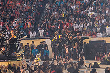 Photograph of Bruno Mars and The Hooligans performing "Uptown Funk" at the Super Bowl 50 halftime show