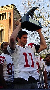 Leinart holding his Heisman trophy at USC's championship celebration held in winter 2005 on the USC campus in Los Angeles.