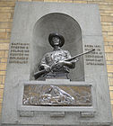 Close up picture of the Selous Memorial in the wall in the main hall of the Natural History Museum