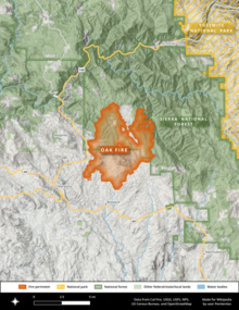 The footprint of the Oak Fire is shown in orange against the Sierra National Forest in green. Yosemite National Park is shown well east, in golden stripes.