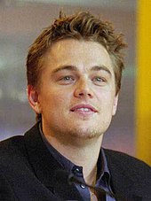 A photograph of Leonardo DiCaprio attending a press conference for The Beach.