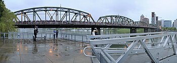 Panoramic view of a crowd of people on a bridge