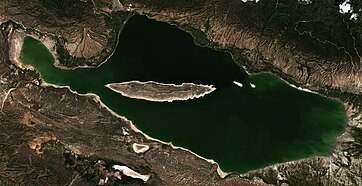 Lake Enriquillo is the biggest saltwater lake—hypersaline lake in the Dominican Republic. It is located in Enriquillo wetlands, and is the largest lake in both the Dominican Republic and Hispaniola, as well as the entire Caribbean. It is also the lowest point for an island country, and also borders Haiti in the north-west area of the lake.