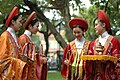 Vietnamese women wear a version of áo Nhật bình with khăn vấn.