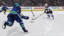 A Vancouver Canucks player breaking his stick when attempting to shoot