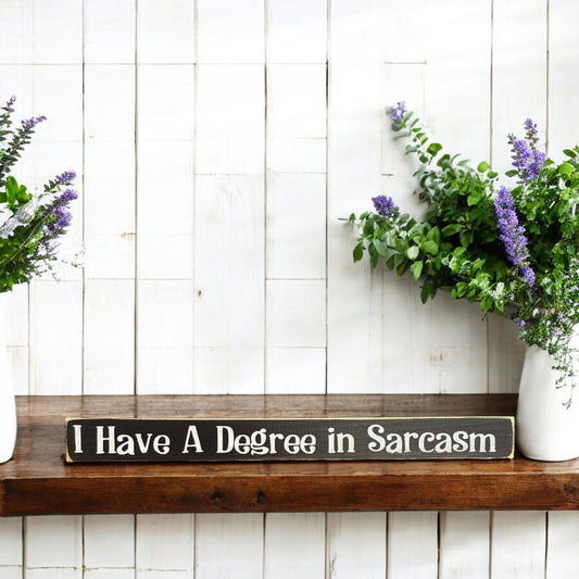 Black and white wood sign with text reading 'I Have a Degree in Sarcasm' - perfect sarcastic sign and funny office decor.