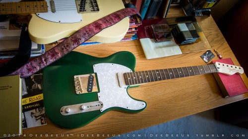 Project update: 2 coats of Dupli-Color “Chrysler Deep Sherwood Green”. I decided to stick some sh*t on it to give you a better idea of what it (might) look like when it’s done. I will probably use the maple neck (shot #2) rather than the rosewood...