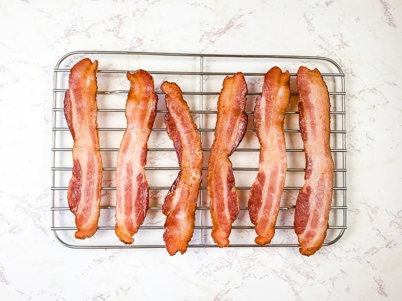 Air fryer bacon on a cooling rack.