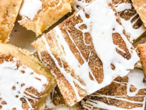 Close up of snickerdoodle bars with icing.