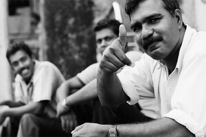 Men sitting by the roadside