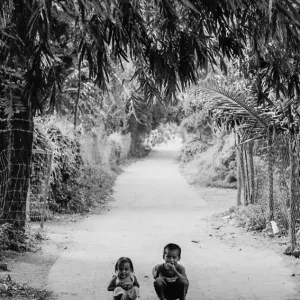 Siblings crouching down together