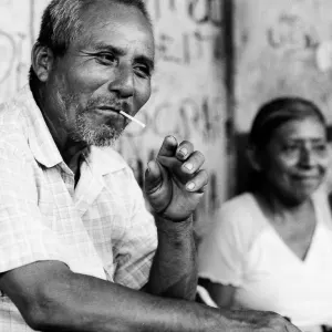 Man putting cigarette into mouth