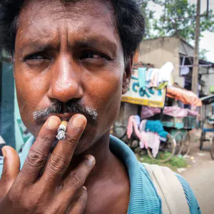 Man smoking short cigarette